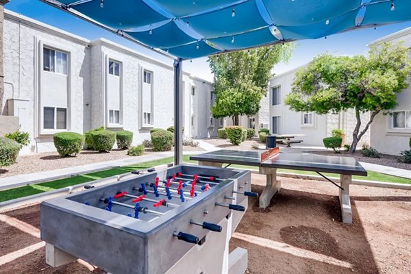 Outdoor sport court with basketball hoops at The Cortesian Apartments