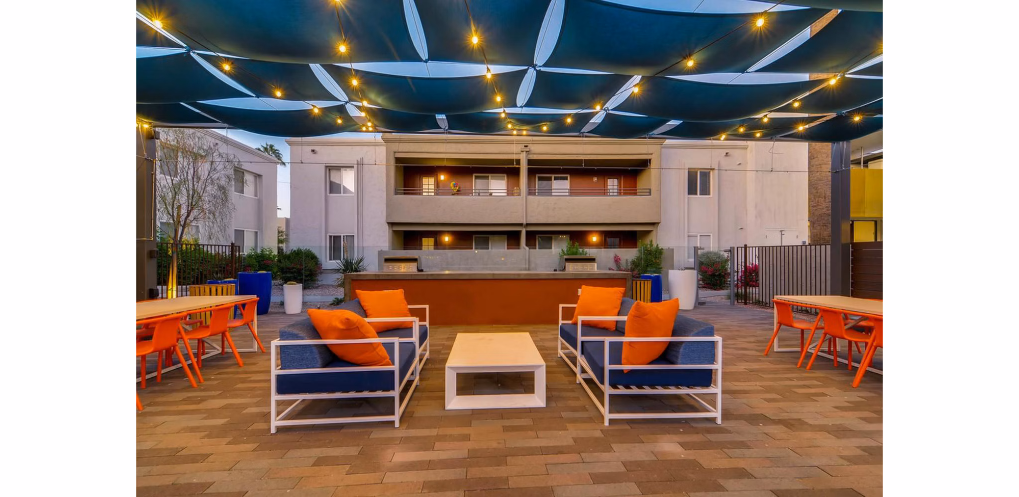 Cozy patio with modern seating at The Cortesian Apartments, perfect for relaxation in a luxury living environment