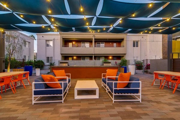 Cozy patio with modern seating at The Cortesian Apartments, perfect for relaxation in a luxury living environment