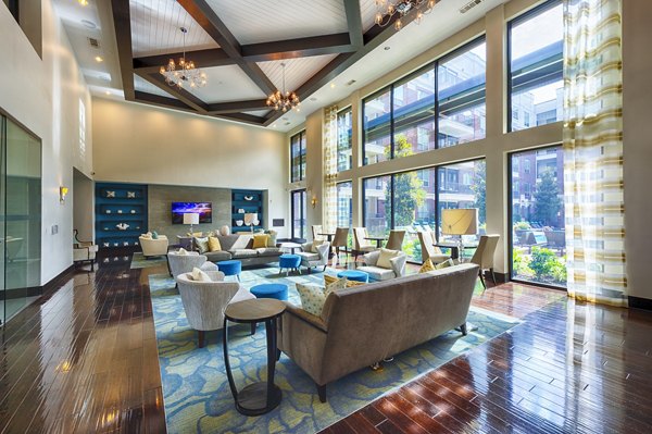 Spacious clubhouse with modern furnishings at Virage Luxury Apartments