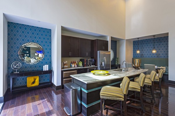 Elegant clubhouse with modern furnishings at Virage Luxury Apartments, perfect for social gatherings and relaxation
