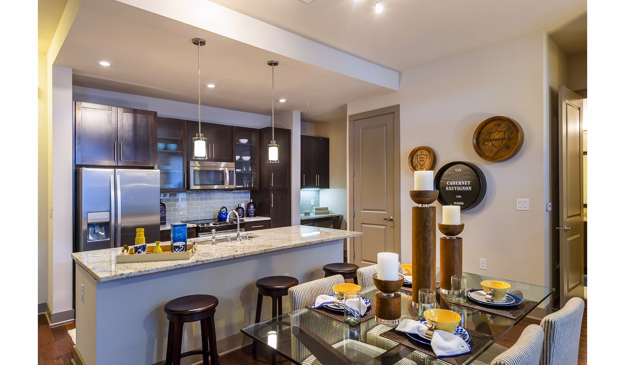 Dining room featuring elegant furnishings and modern lighting at Virage Luxury Apartments