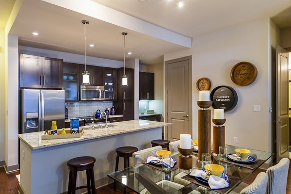 Dining room featuring elegant furnishings and modern lighting at Virage Luxury Apartments