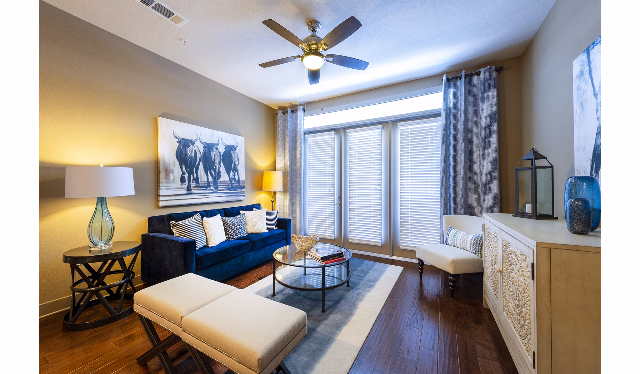 Elegant living room with cozy seating and modern decor at Virage Luxury Apartments