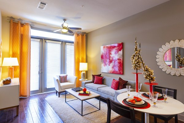 Spacious living room with modern decor at Virage Luxury Apartments, ideal for comfortable urban living and relaxation