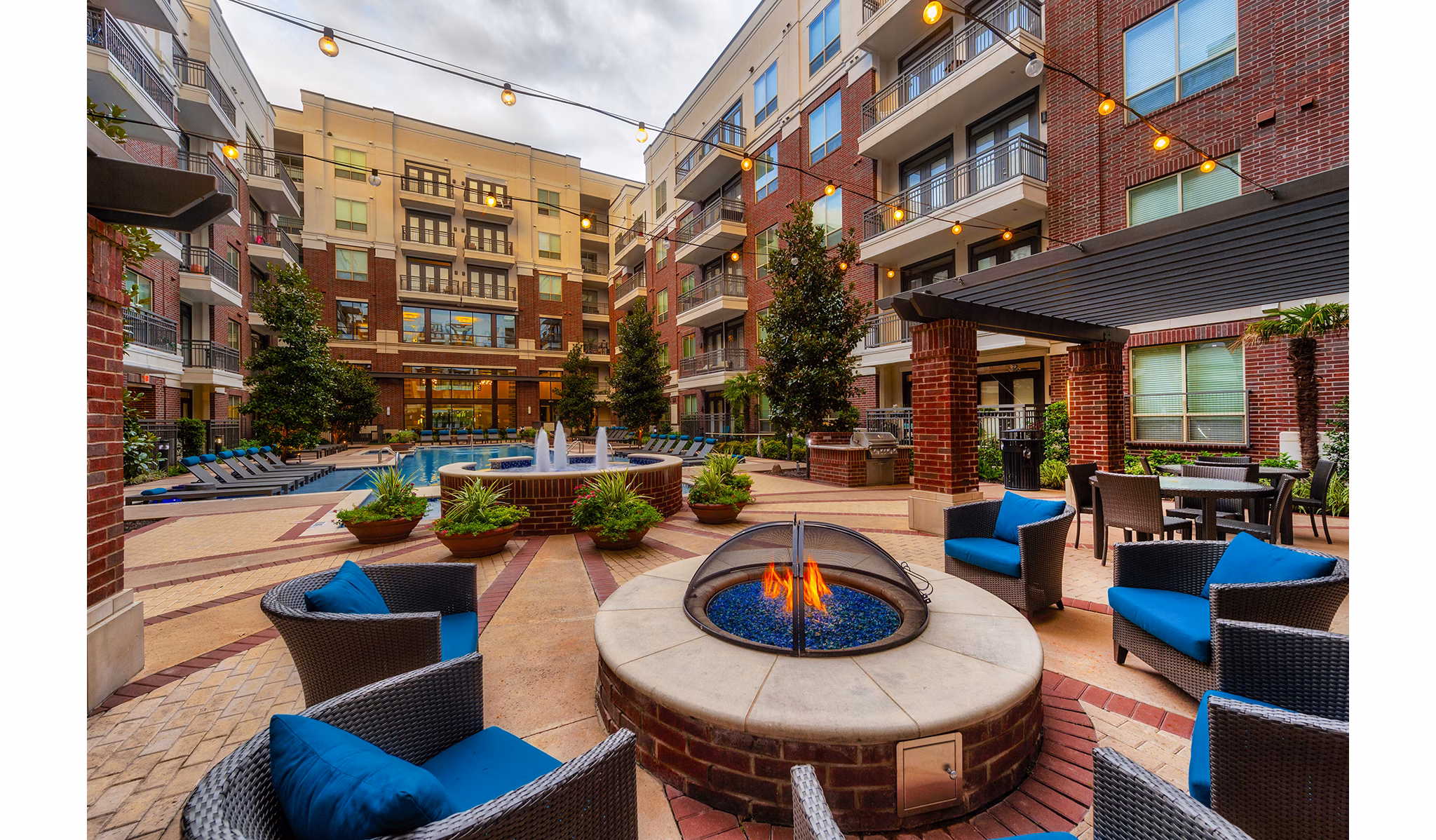 Skyline views from a modern rooftop deck at Virage Luxury Apartments
