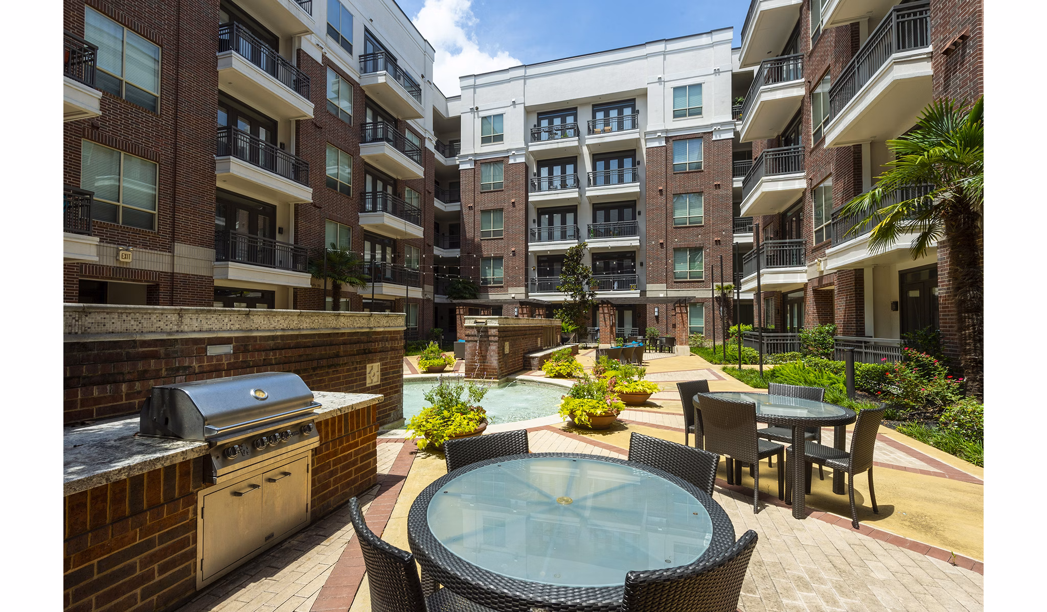Outdoor grilling area with modern amenities at Virage Luxury Apartments