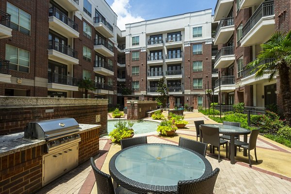 Outdoor grilling area with modern amenities at Virage Luxury Apartments