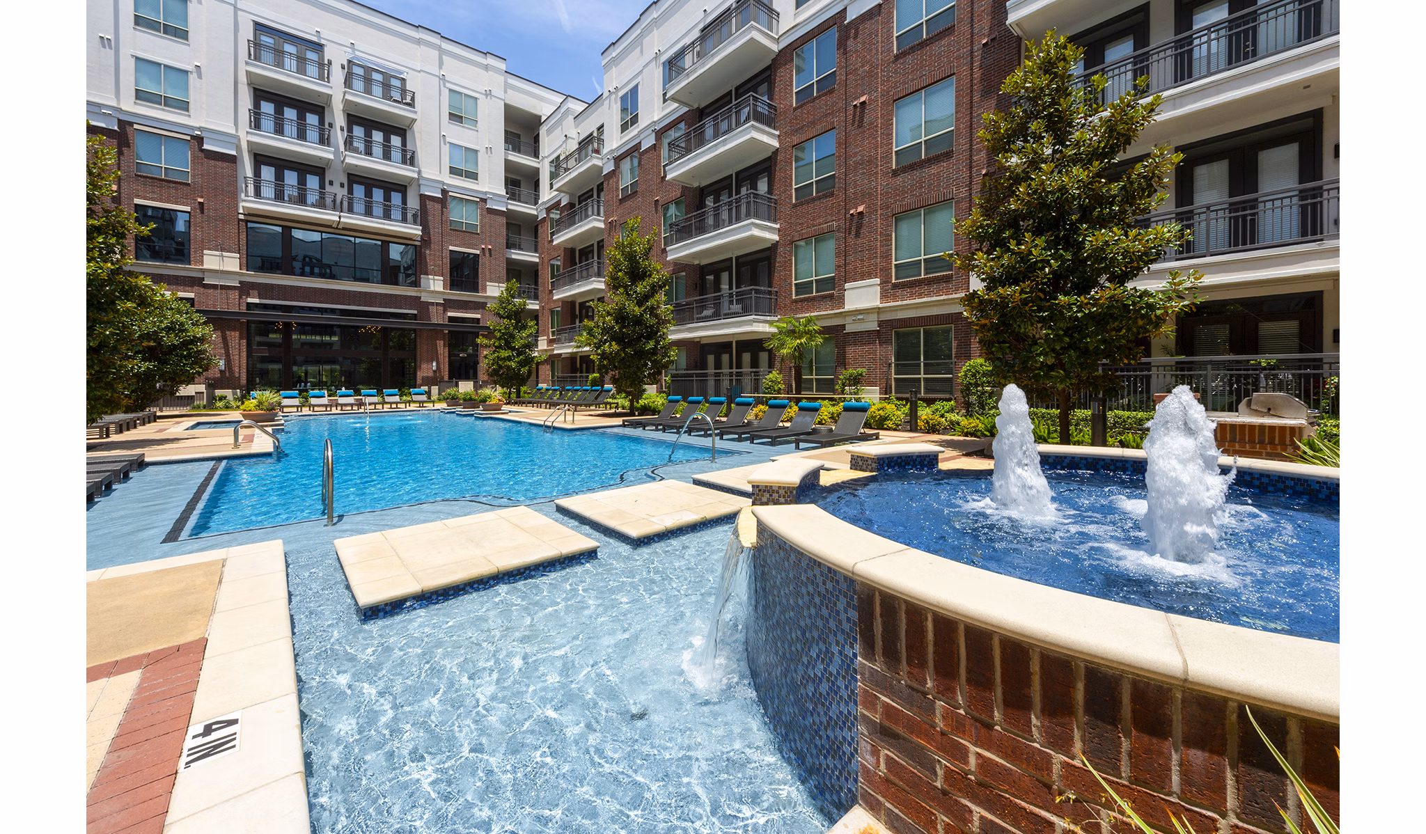 Outdoor grill area with stainless steel appliances at Virage Luxury Apartments, perfect for entertaining in style