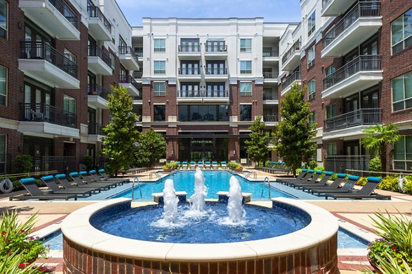 Outdoor pool with resort-style seating at Virage Luxury Apartments