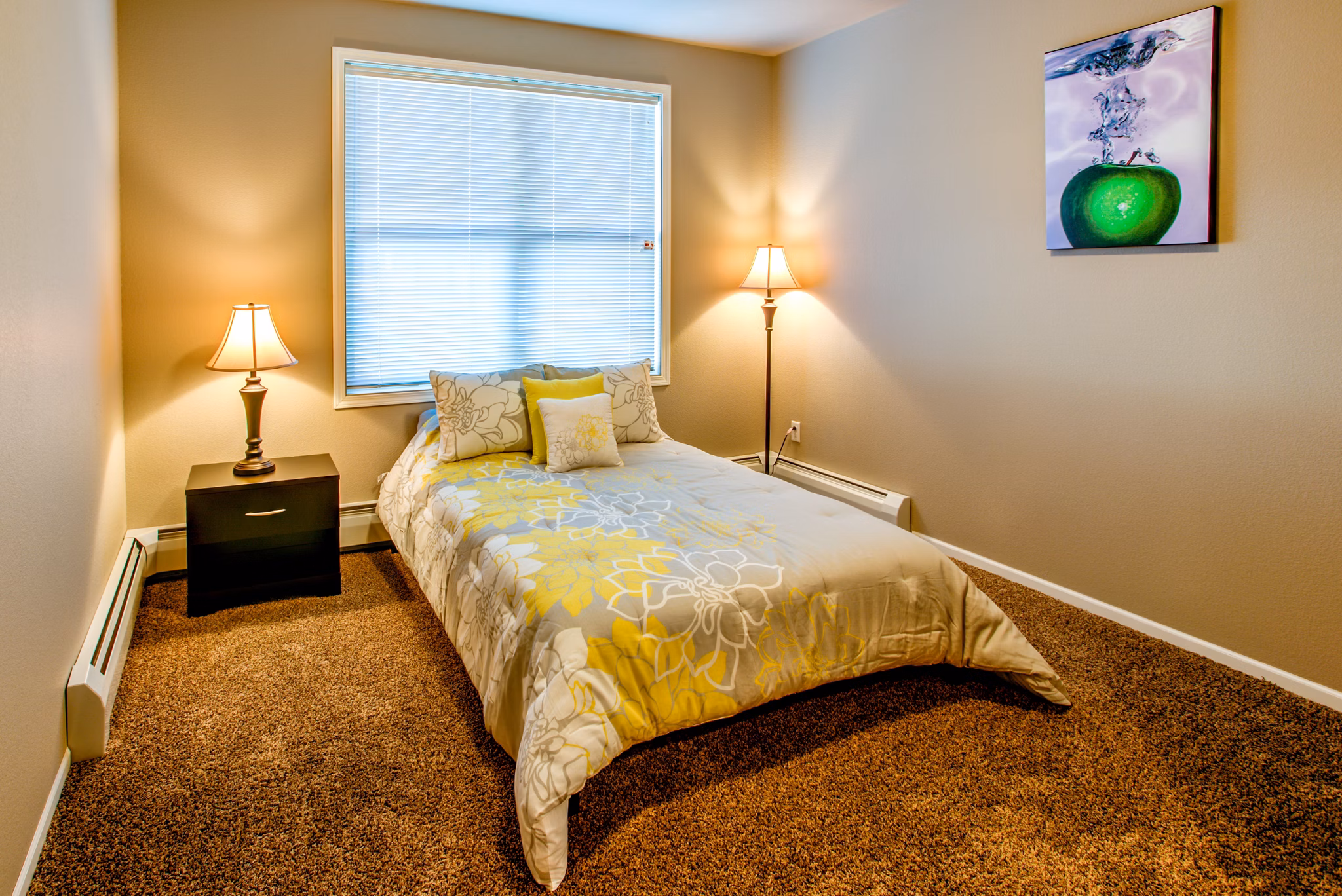 Modern bedroom with plush bedding and natural light at Fair Hills Apartments in Texas