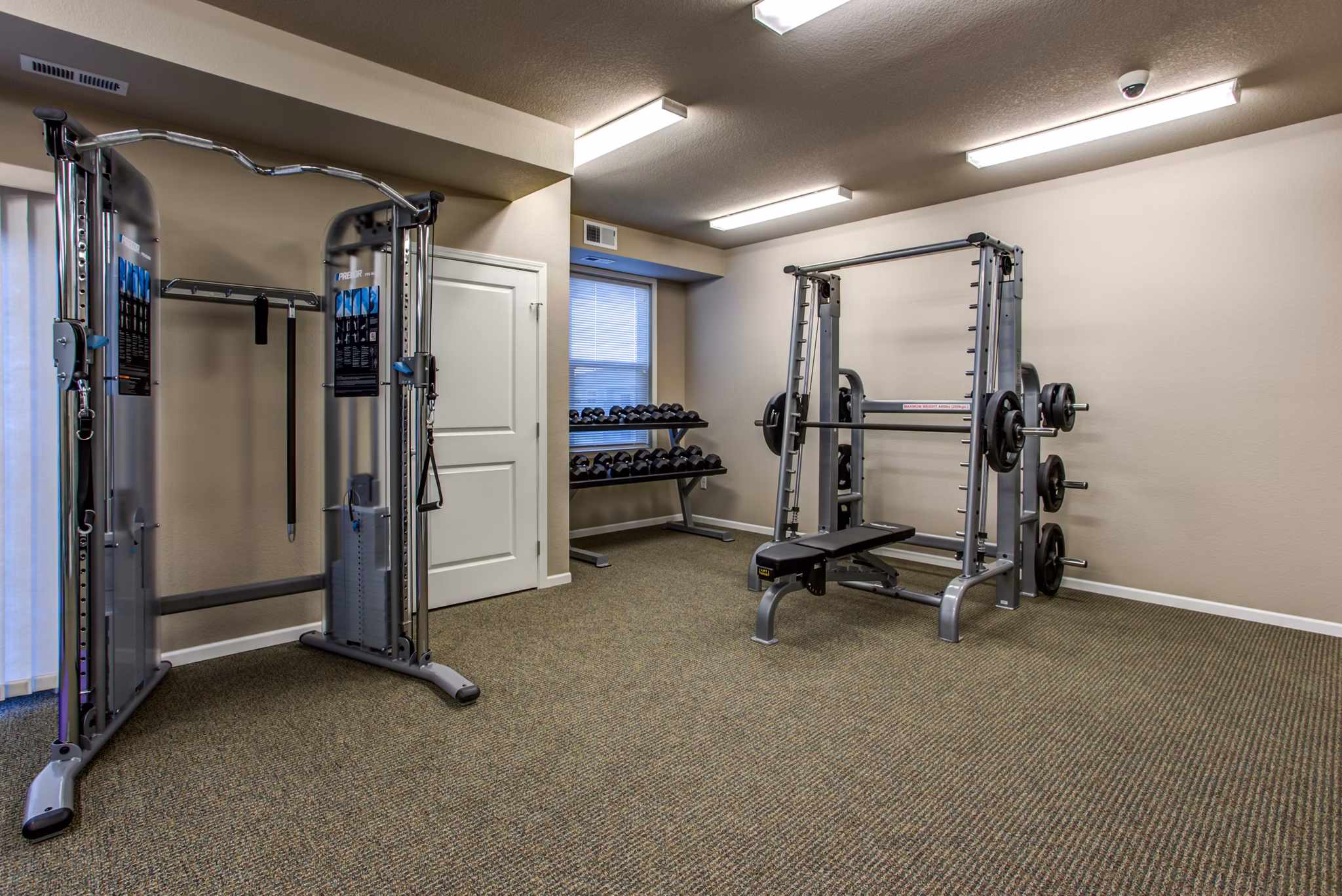 State-of-the-art fitness center at Fair Hills Apartments featuring modern gym equipment and spacious workout areas