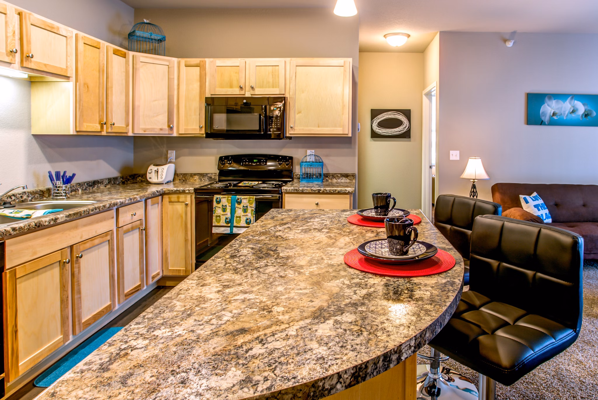 Modern kitchen featuring sleek countertops and stainless steel appliances at Fair Hills Apartments