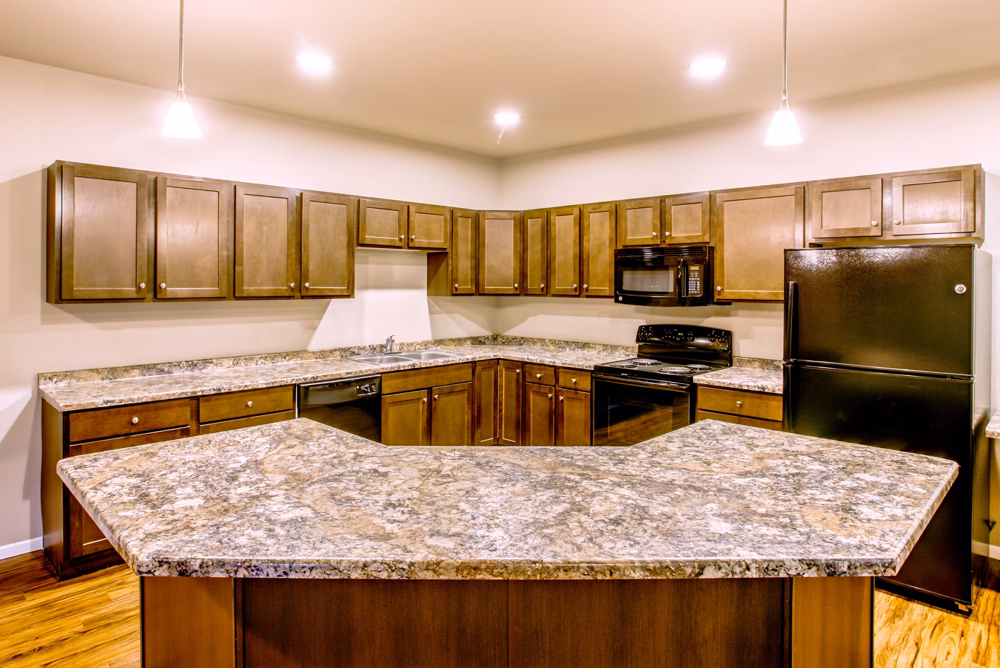 Modern kitchen with stainless steel appliances at Fair Hills Apartments