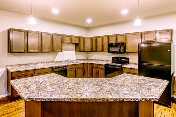 Modern kitchen with stainless steel appliances at Fair Hills Apartments