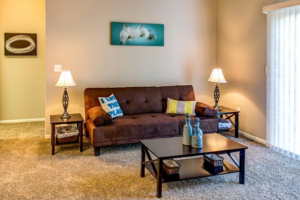Spacious living room with modern furnishings at Fair Hills Apartments
