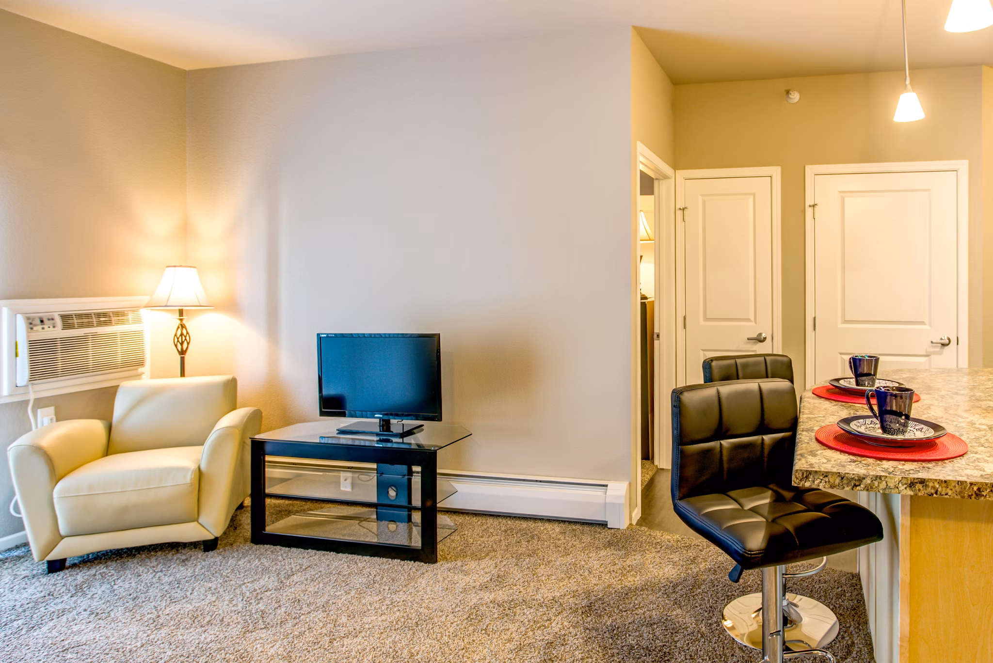 Spacious living room with modern decor and natural lighting at Fair Hills Apartments