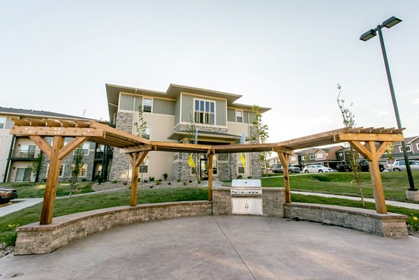 Outdoor grill area at Fair Hills Apartments: Modern BBQ amenities for residents to enjoy outdoor cooking and dining