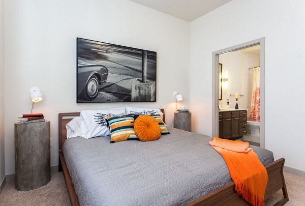 Cozy bedroom with contemporary decor at Agave Apartments, a Greystar luxury community
