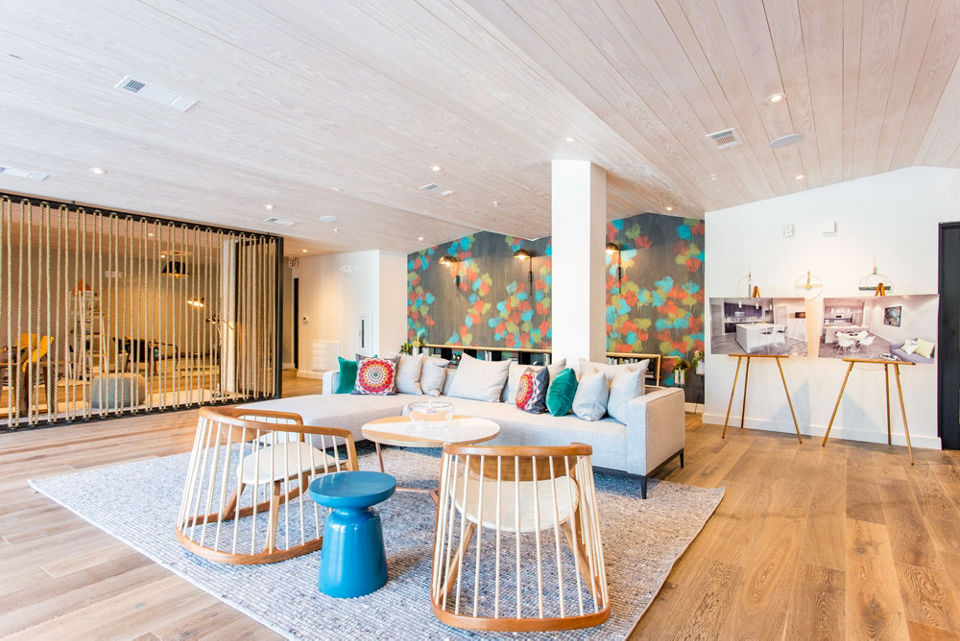Clubhouse featuring modern furnishings and a game area at Agave Apartments