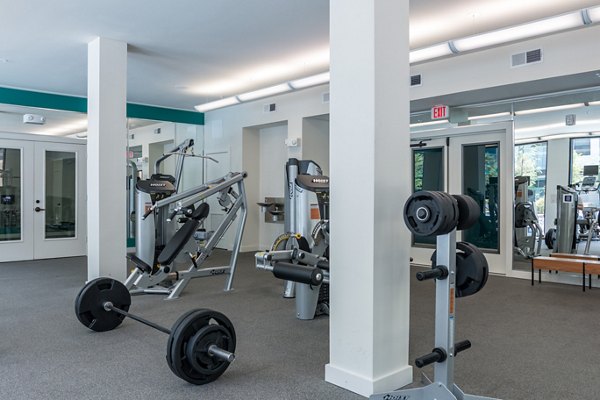 Fitness center with modern equipment at Agave Apartments