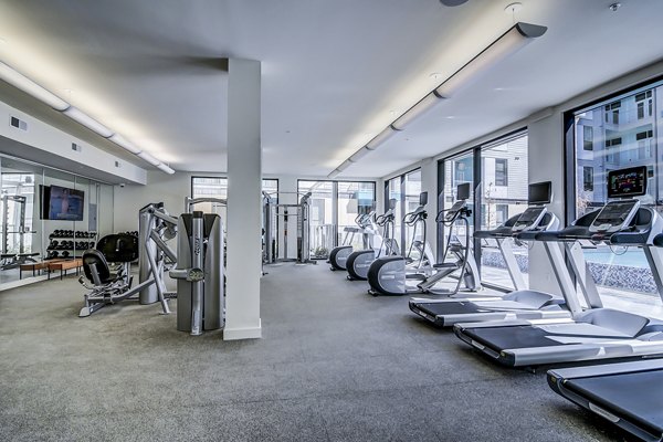 State-of-the-art fitness center featuring cardio equipment at Agave Apartments
