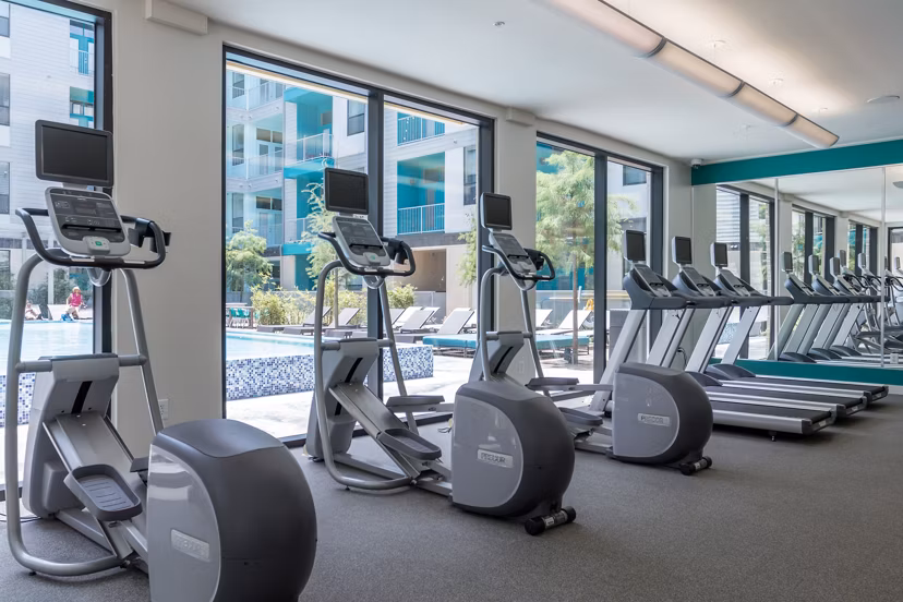 State-of-the-art fitness center with modern equipment at Agave Apartments