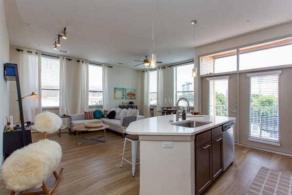 Modern kitchen featuring stainless steel appliances and granite countertops at Agave Apartments luxury residential community