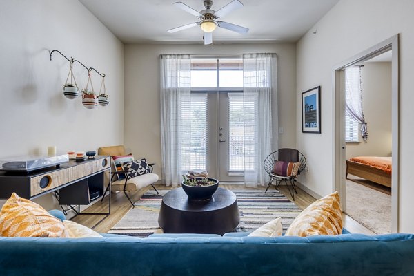 Modern living room with stylish furniture and natural light at Agave Apartments, part of Greystar luxury apartments portfolio
