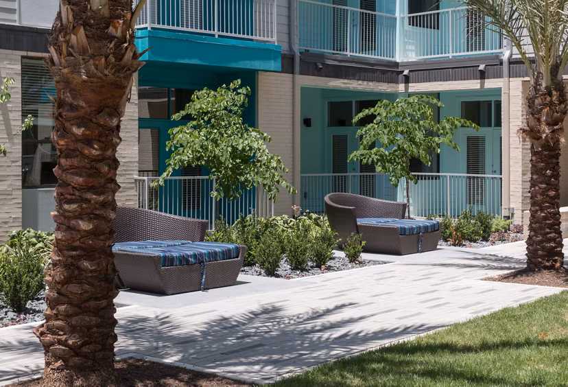 Private patio with stylish outdoor furniture at Agave Apartments
