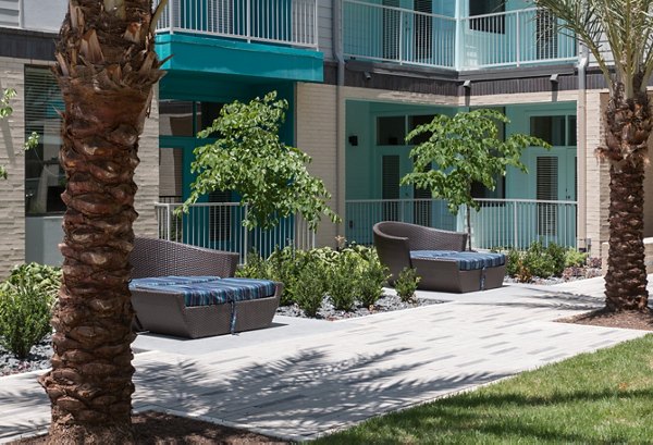 Private patio with stylish outdoor furniture at Agave Apartments