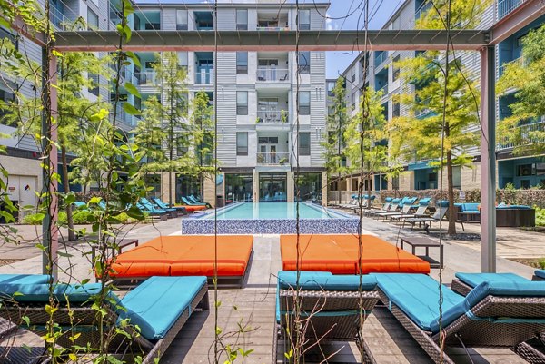 Rooftop pool with serene city views at Agave Apartments