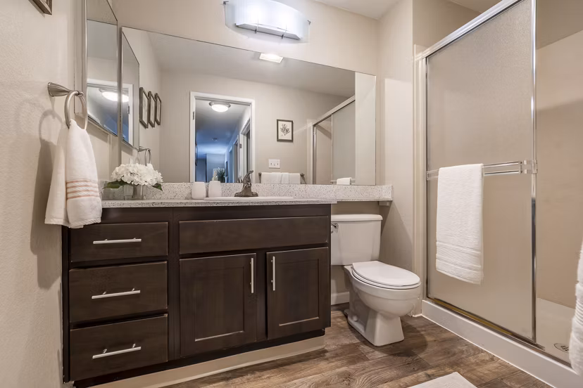 Luxurious bathroom featuring marble countertops at The Seasons Apartments