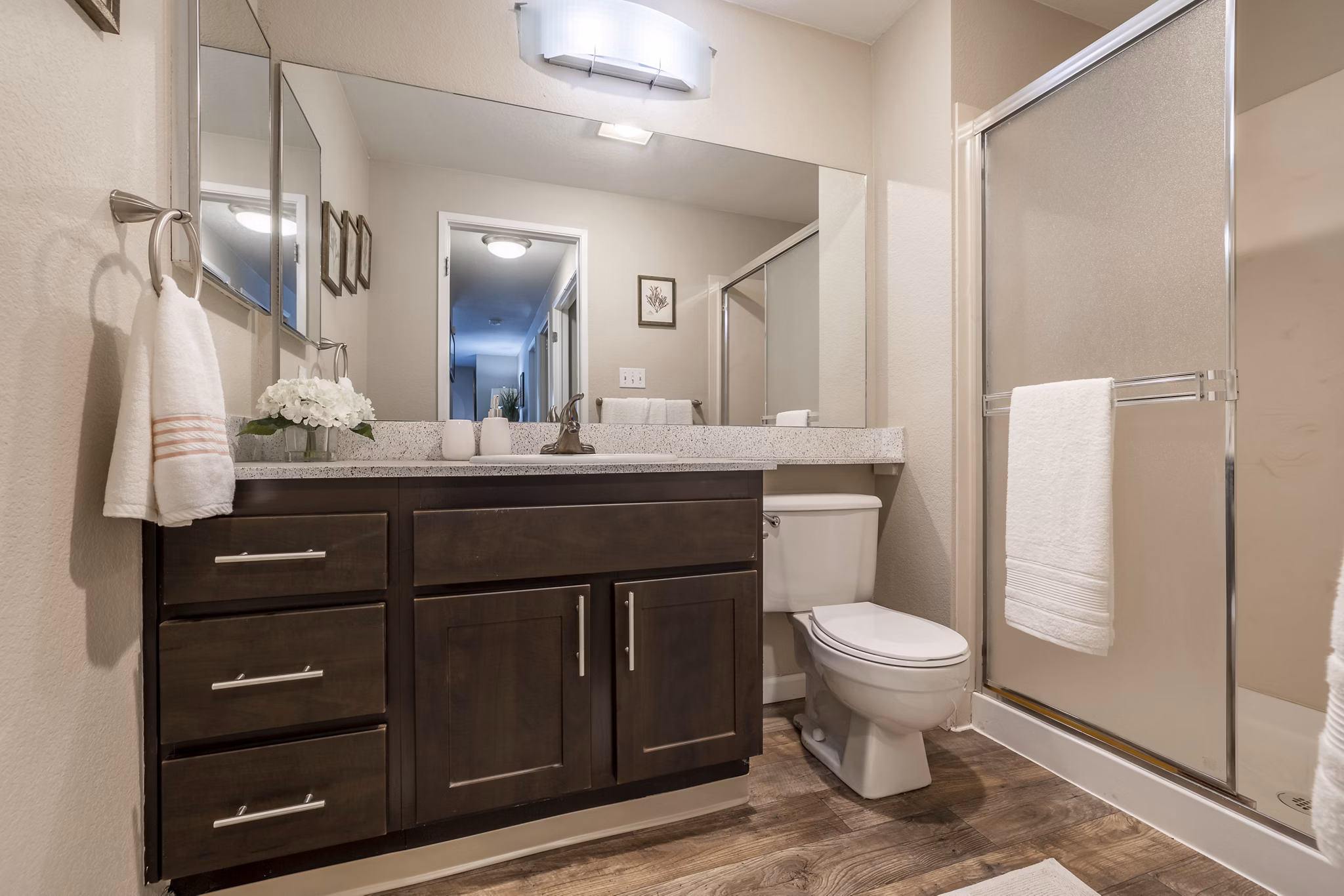 Luxurious bathroom featuring marble countertops at The Seasons Apartments
