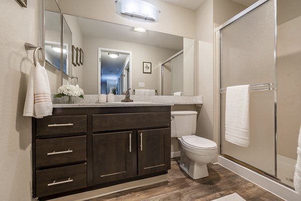 Luxurious bathroom featuring marble countertops at The Seasons Apartments