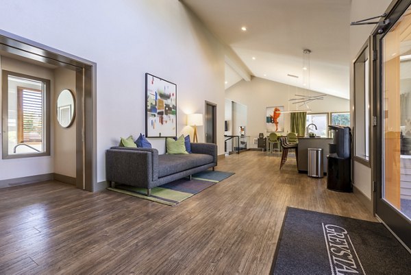 The Seasons Apartments: Elegant clubhouse with contemporary furnishings and communal seating areas