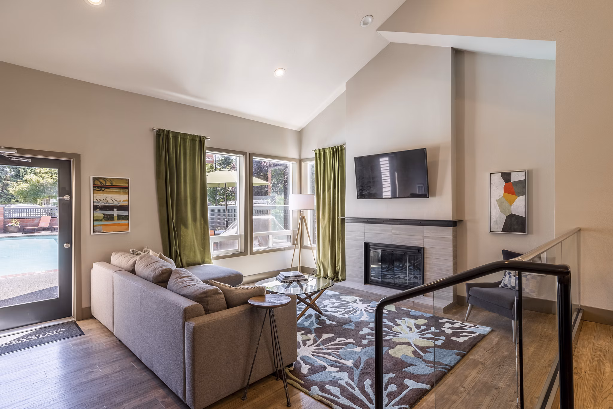 Clubhouse with modern decor and seating at The Seasons Apartments offering luxury living and communal spaces for residents