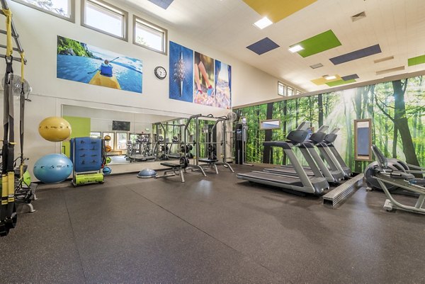 State-of-the-art fitness center with modern equipment at The Seasons Apartments