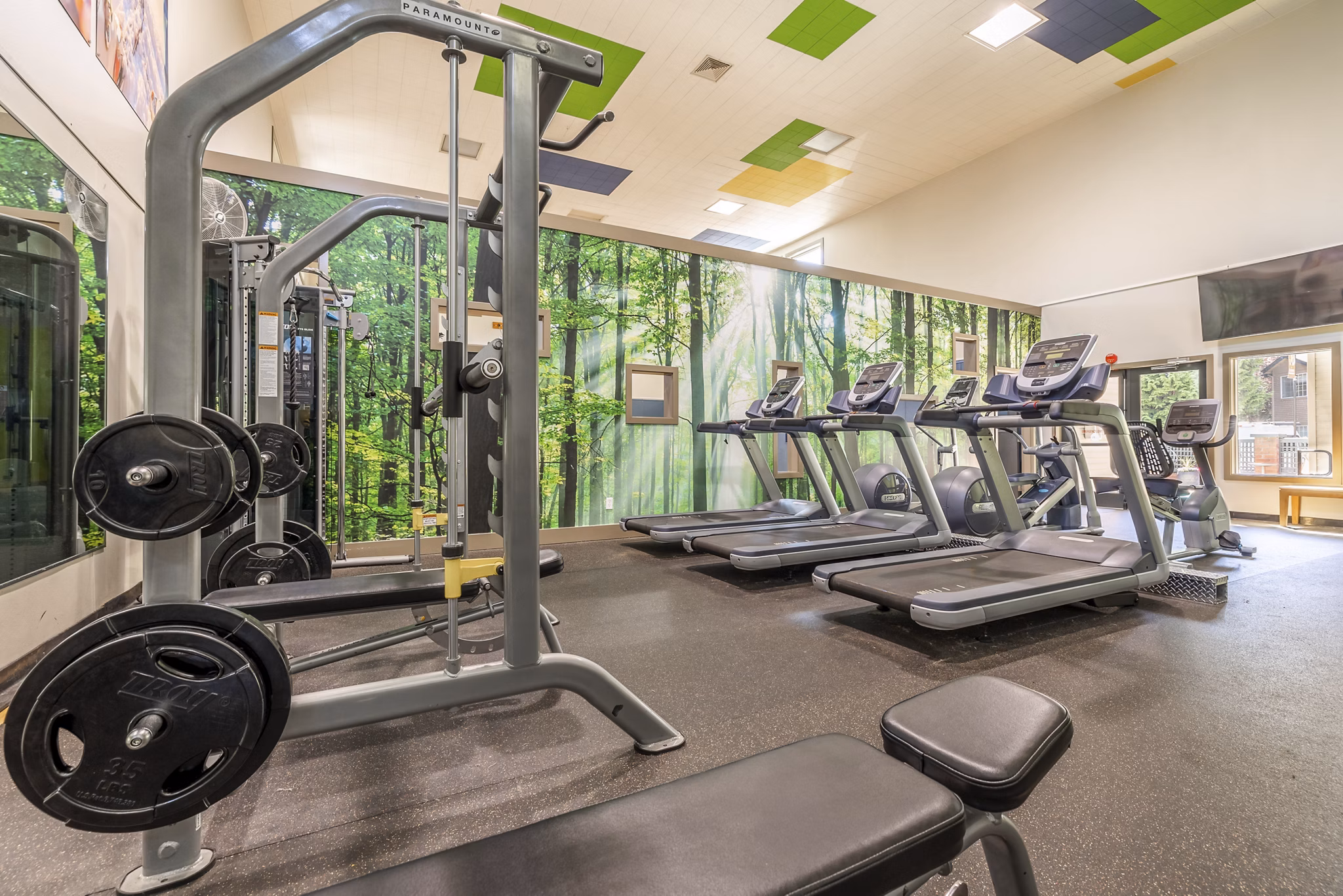 Modern fitness center with state-of-the-art equipment at The Seasons Apartments