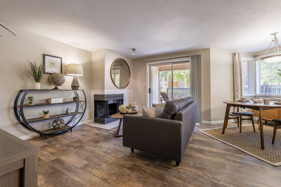 Spacious living room with modern decor in The Seasons Apartments