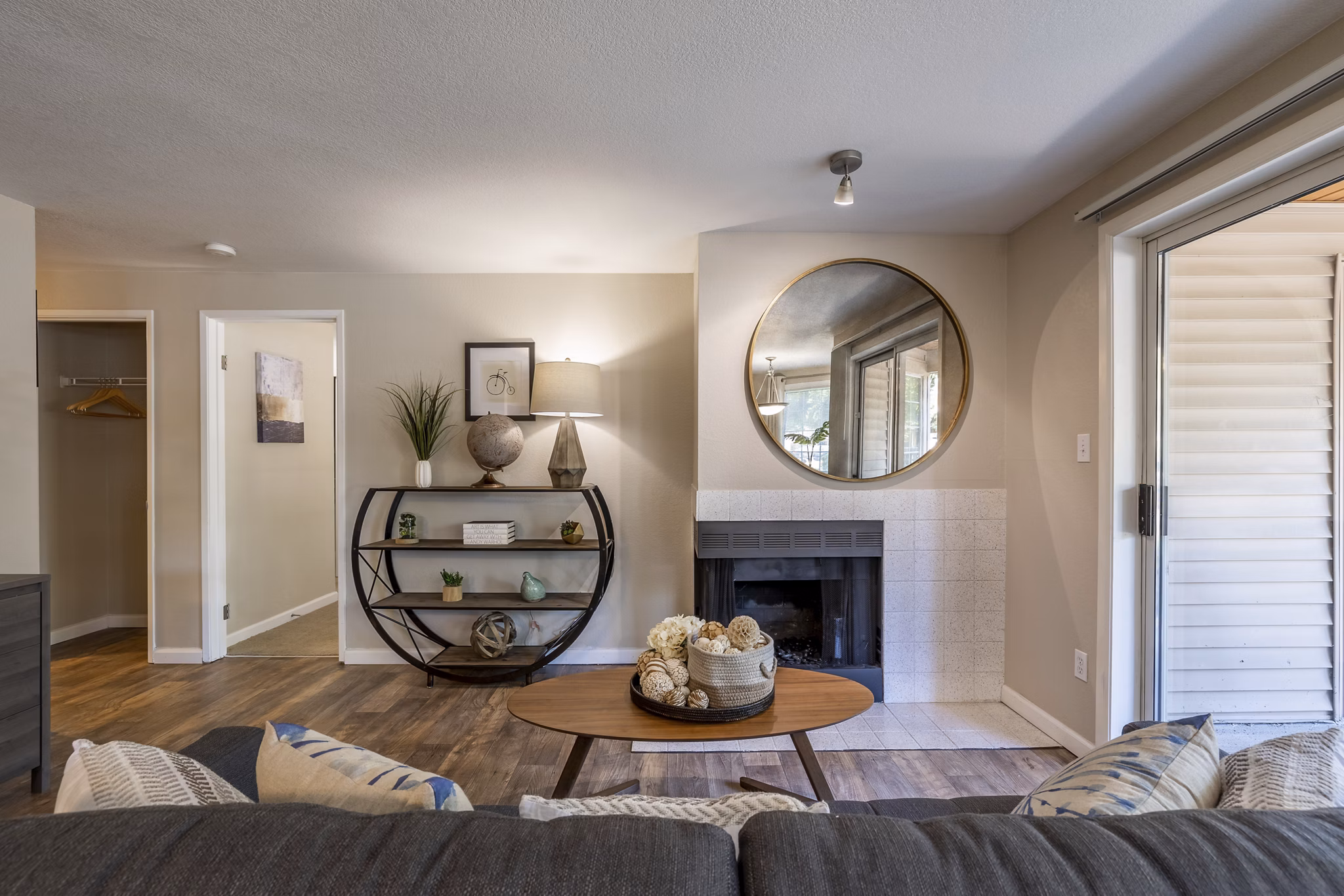 Cozy living room with a fireplace and modern decor in The Seasons Apartments