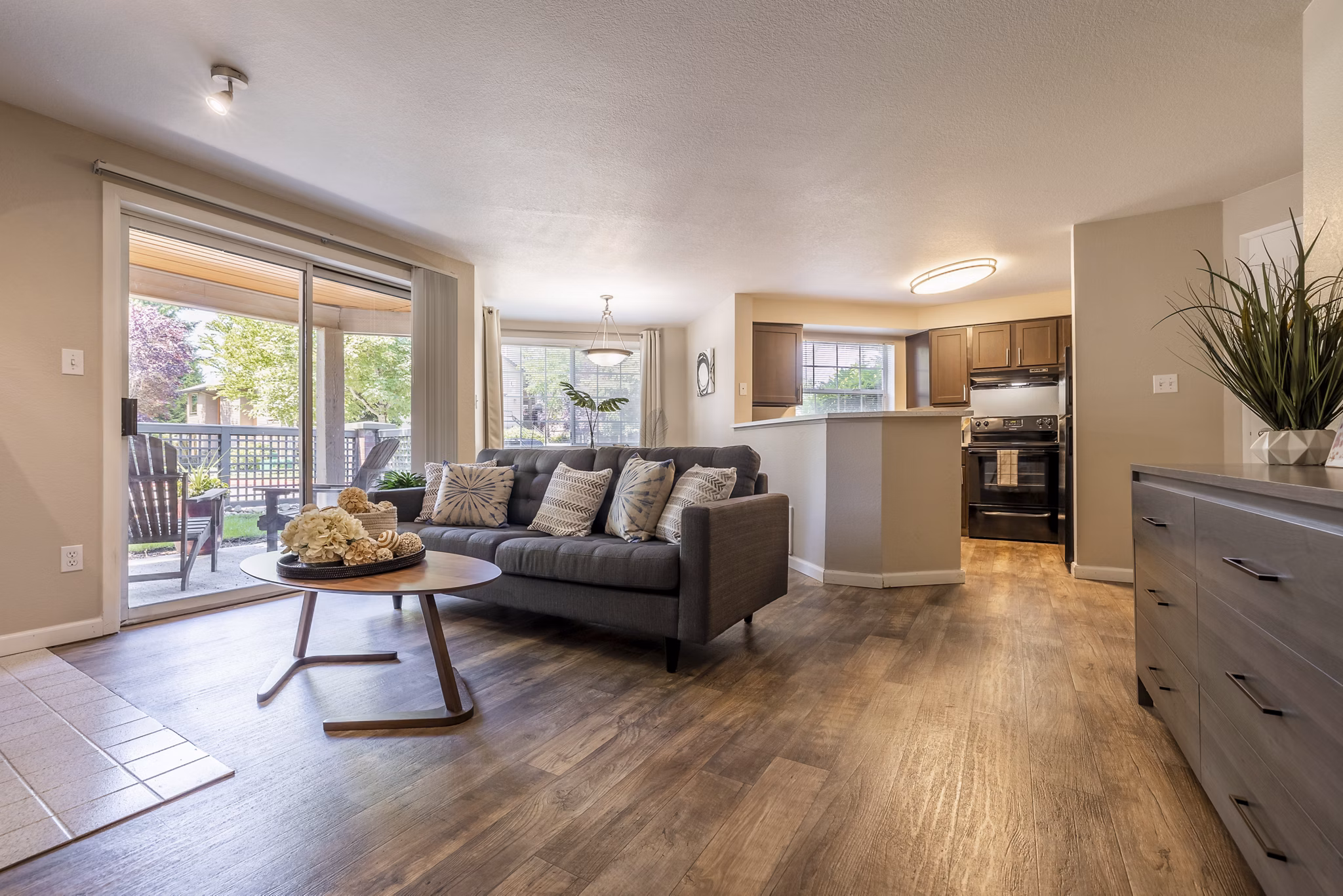 Spacious living room with elegant decor in The Seasons Apartments, offering a cozy and modern living experience in luxury apartments