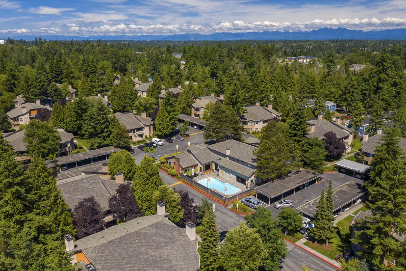 Front view of The Seasons Apartments: Luxury living with verdant gardens and contemporary design in a vibrant neighborhood