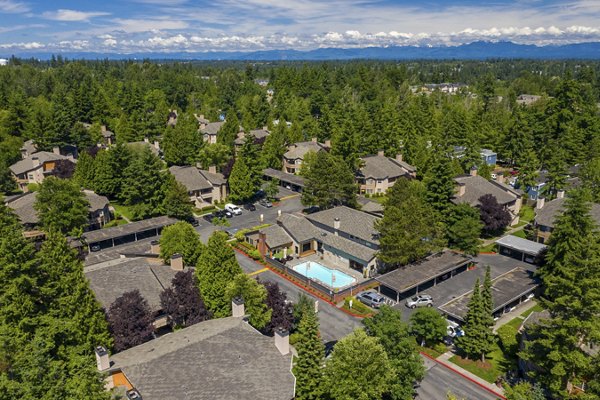 Front view of The Seasons Apartments: Luxury living with verdant gardens and contemporary design in a vibrant neighborhood