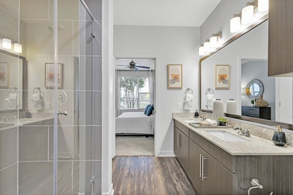 Modern bathroom with sleek fixtures at Oak & Ellum Apartments, Greystar community in Dallas