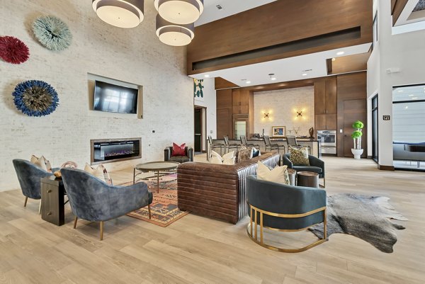 Modern clubhouse featuring lounge seating and billiards table at Oak & Ellum Apartments