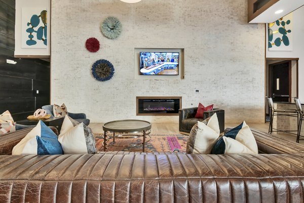Clubhouse with modern decor and seating at Oak & Ellum Apartments