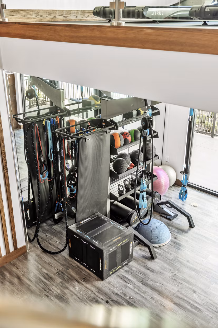 Modern fitness center with state-of-the-art equipment at Oak & Ellum Apartments