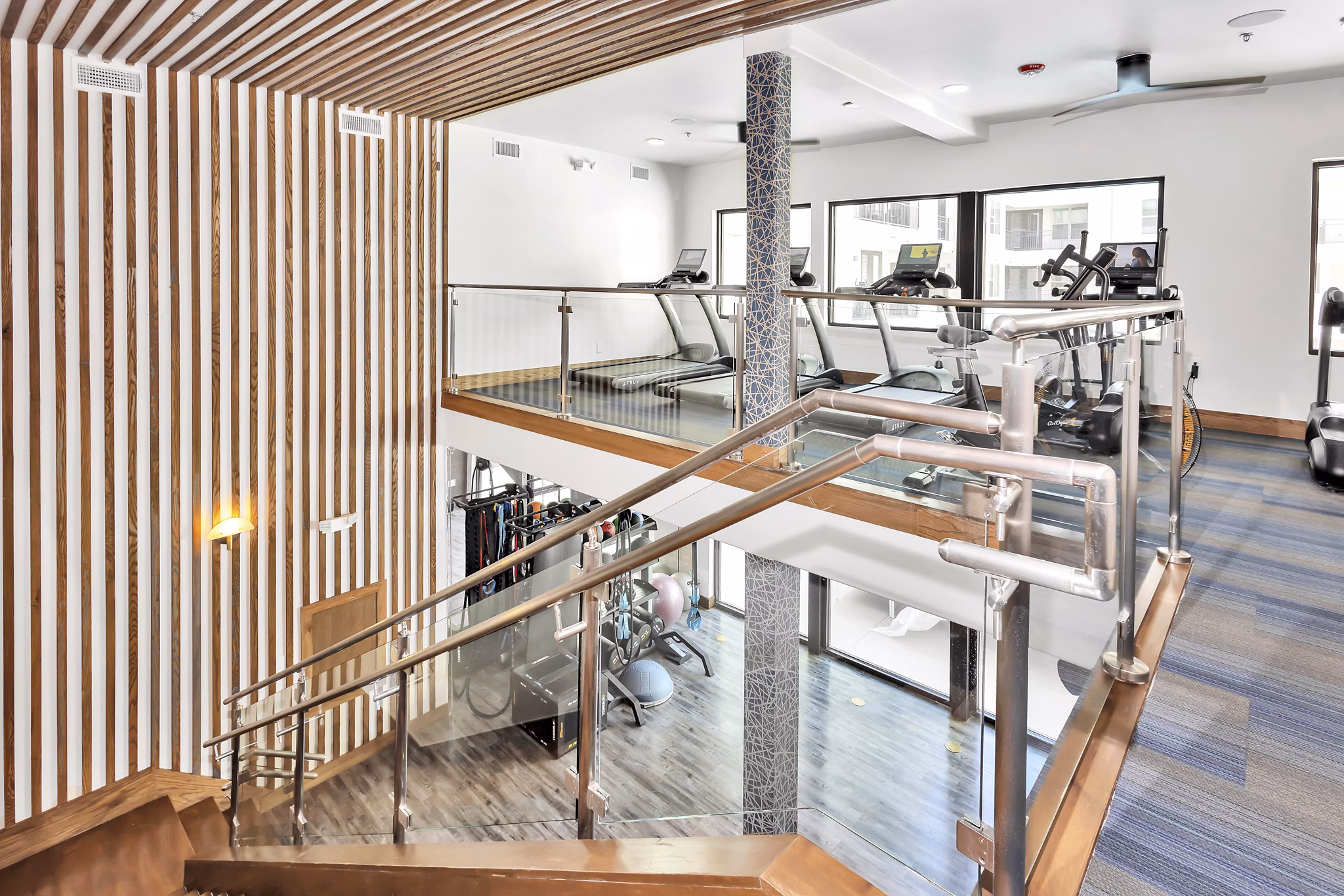 Modern fitness center with state-of-the-art equipment at Oak & Ellum apartments, perfect for luxury living