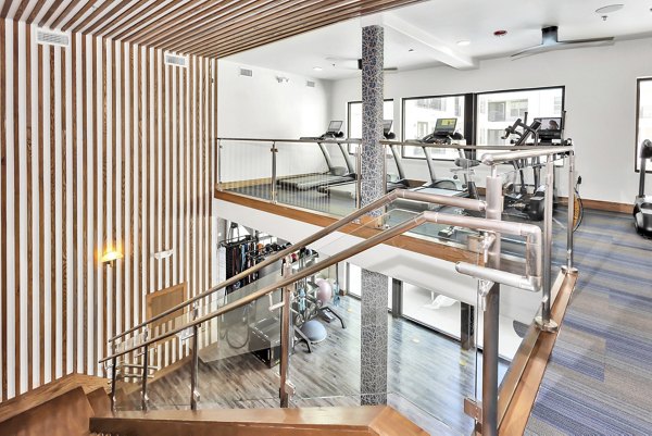 Modern fitness center with state-of-the-art equipment at Oak & Ellum apartments, perfect for luxury living